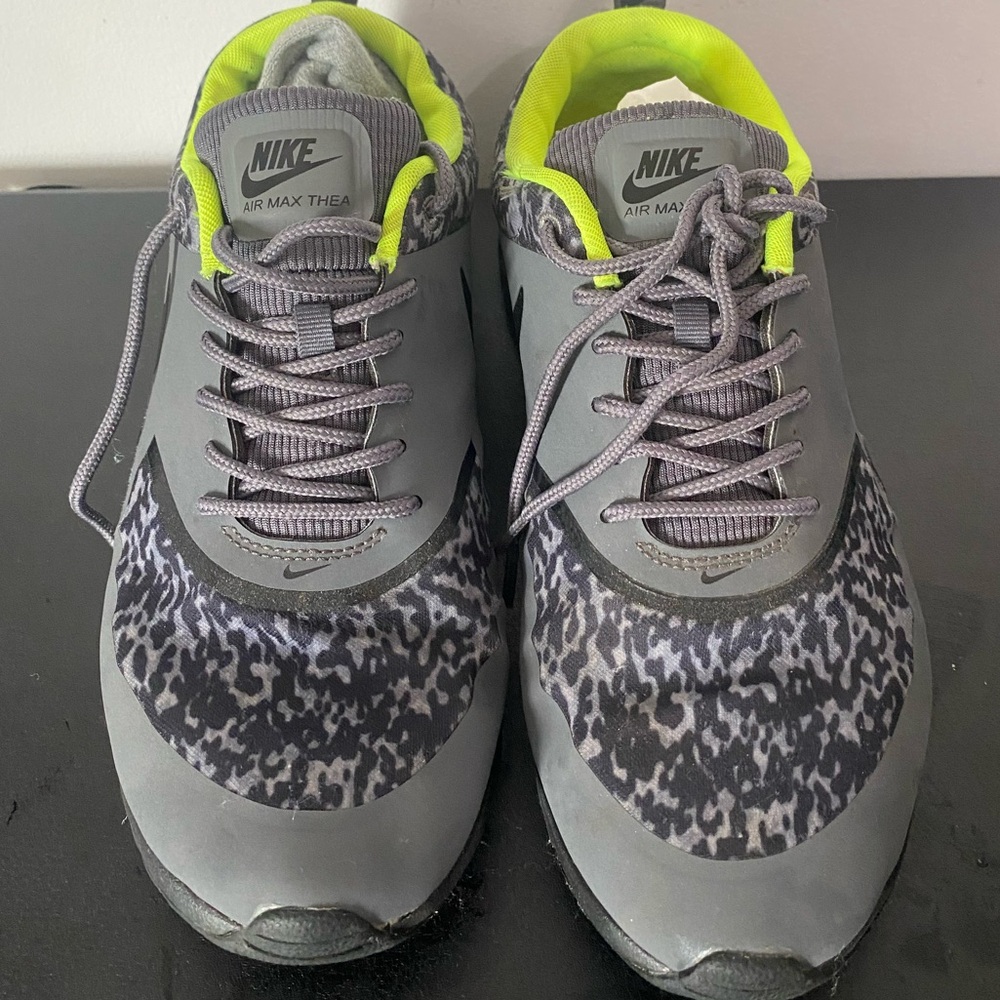 Grey and neon yellow Nike sneakers
